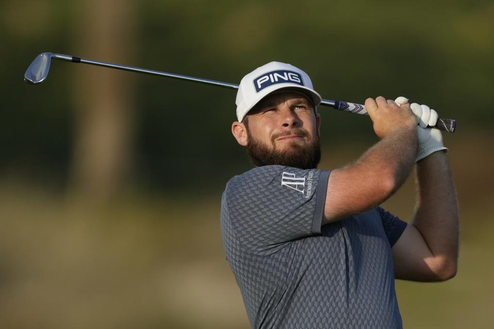 Tyrrell Hatton of England plays his second shot on 14th hole during the first round of the Hero Dubai Desert Classic golf tournament, in Dubai, United Arab Emirates, Thursday, Jan. 18, 2024. (AP Photo/Kamran Jebreili)