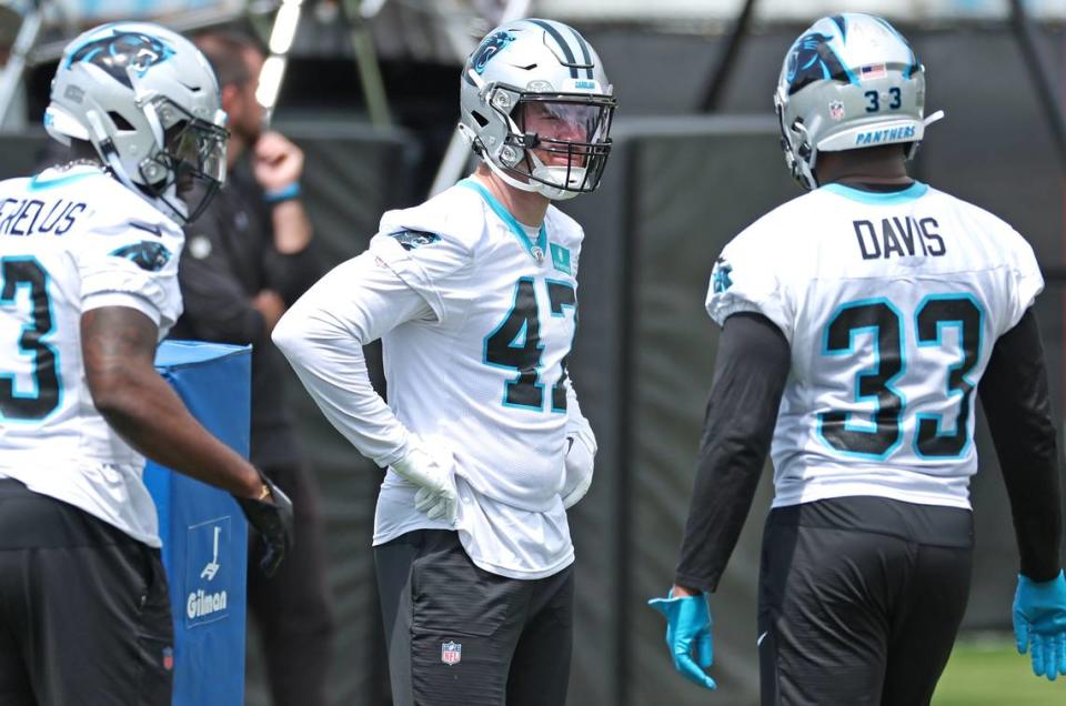 Carolina Panthers linebacker Josey Jewell, center, waits along the sideline for drills to resume at the team’s voluntary minicamp practice on Wednesday, April 24, 2024.