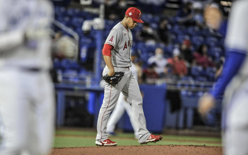 Los Angeles Angels starter Jose Quintana walks back to the mound after giving up a bases-loaded walk to Toronto Blue Jays' Vladimir Guerrero Jr. during the second inning of a baseball game Saturday, April 10, 2021, in Dunedin, Fla. (AP Photo/Steve Nesius)