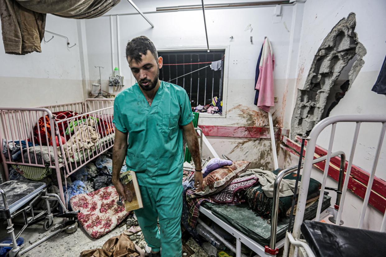 A man inspects the damage in a room following Israeli bombardment at Nasser hospital in Khan Yunis (AFP via Getty Images)