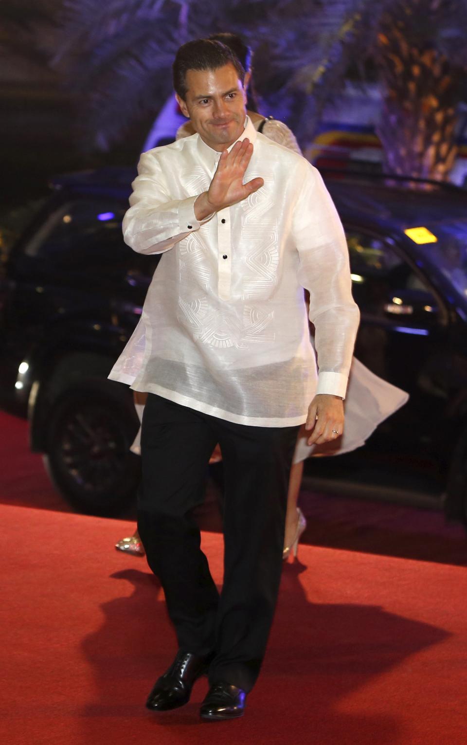 Mexico's President Enrique Pena Nieto arrives in a traditional barong for a welcome dinner during the Asia-Pacific Economic Cooperation (APEC) summit in the capital city of Manila