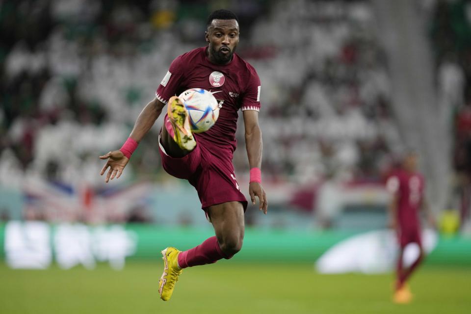 Qatar's Ismail Mohamad controls the ball during the World Cup group A soccer match between Qatar and Senegal, at the Al Thumama Stadium in Doha, Qatar, Friday, Nov. 25, 2022. (AP Photo/Thanassis Stavrakis)