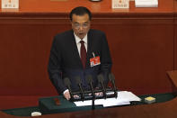 Chinese Premier Li Keqiang delivers a speech during the opening session of China's National People's Congress (NPC) at the Great Hall of the People in Beijing, Friday, March 5, 2021. China’s No. 2 leader has set a healthy economic growth target and vowed to make this nation self-reliant in technology amid tension with Washington and Europe over trade and human rights. (AP Photo/Andy Wong)