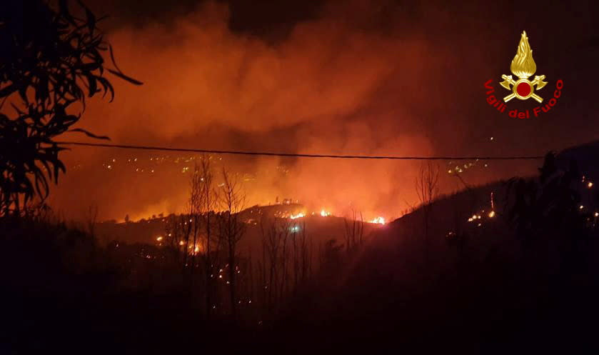 Flames and smoke rise as a wildfire burns near the Sicilian village of Curcuraci near Messina, Italy, July 25, 2023. Vigili del Fuoco/Handout via REUTERS ATTENTION EDITORS THIS IMAGE HAS BEEN SUPPLIED BY A THIRD PARTY. DO NOT OBSCURE LOGO.