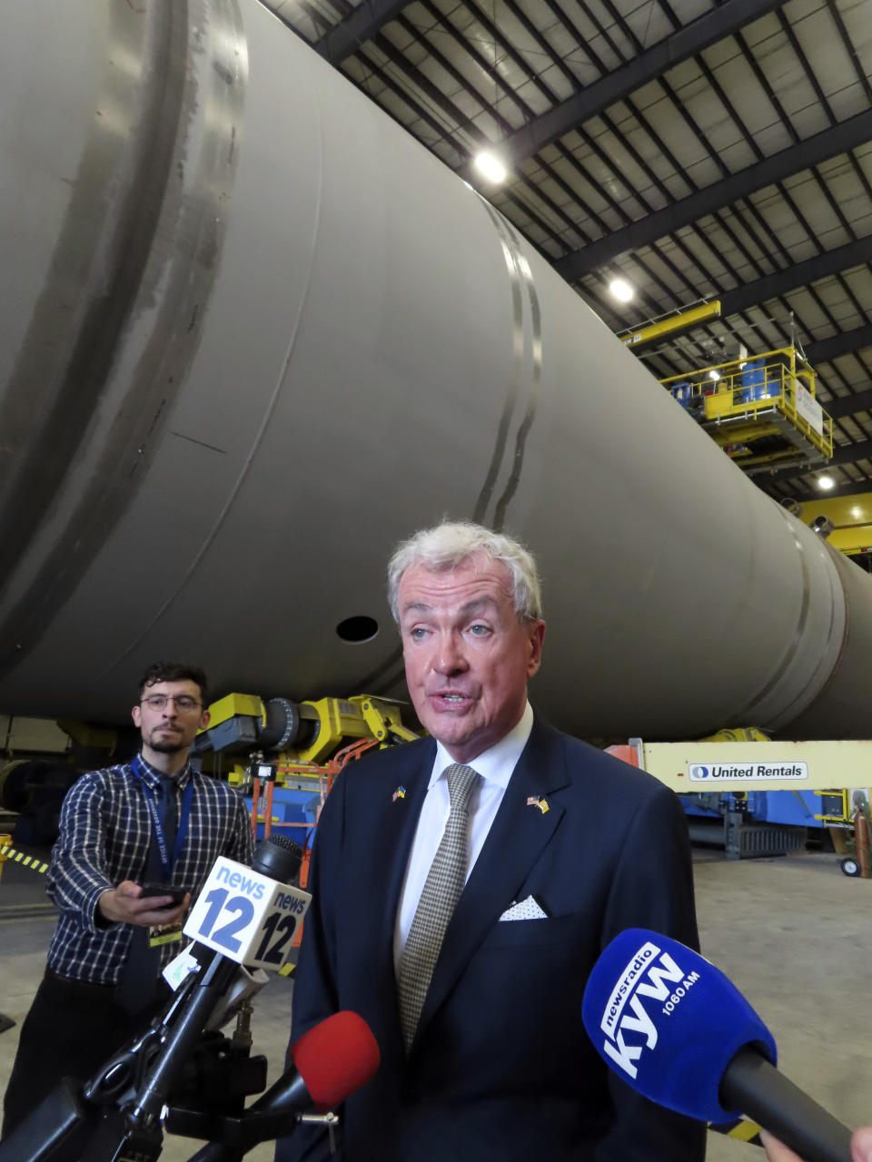 New Jersey Gov. Phil Murphy speaks to reporters after signing a bill in Paulsboro, N.J., Thursday, July 6, 2023, granting a tax break to offshore wind energy developer Orsted. (AP Photo/Wayne Parry)