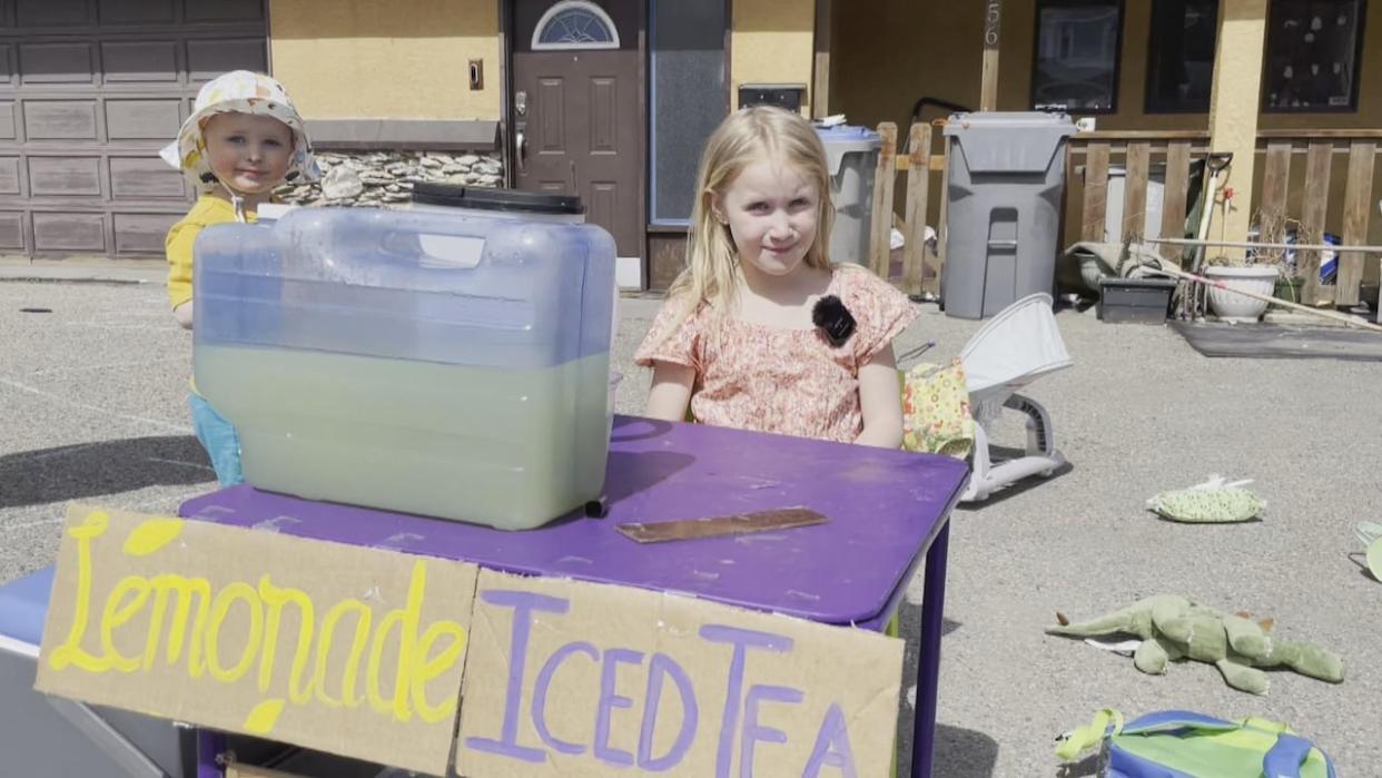 Emma English, 8, set up a lemonade stand earlier this week to fundraise for a private autism assessment for her brother Bodhi, 4.  (Jenifer Norwell/CBC - image credit)