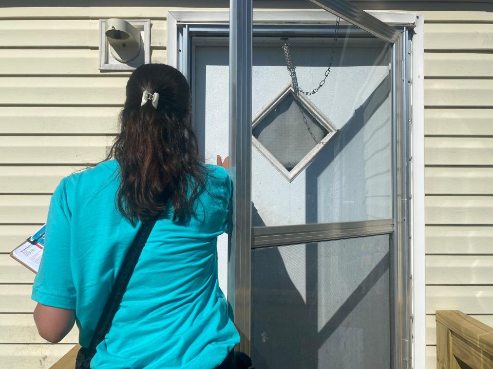 Jackie Ramirez, canvasser for Siembra NC, knocking on doors in Smithfield, NC to register Latino voters