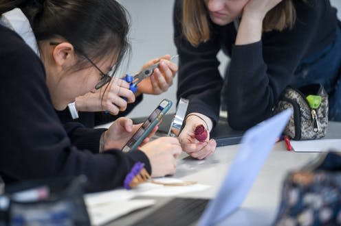 <span class="caption">Research suggests getting pupils involved in designing better rules around phones in school </span> <span class="attribution"><a class="link " href="https://www.alamy.com/students-use-a-mobile-phone-in-an-art-class-at-royal-high-school-bath-which-is-a-day-and-boarding-school-for-girls-aged-3-18-and-also-part-of-the-girls-day-school-trust-the-leading-network-of-independent-girls-schools-in-the-uk-image219383381.html?pv=1&stamp=2&imageid=83B9625A-A7E6-489E-A240-B95422FF6516&p=309238&n=142&orientation=0&pn=1&searchtype=0&IsFromSearch=1&srch=foo%3Dbar%26st%3D0%26sortby%3D2%26qt%3Dschool%2520uk%2520phone%26qt_raw%3Dschool%2520uk%2520phone%26qn%3D%26lic%3D3%26edrf%3D0%26mr%3D0%26pr%3D0%26aoa%3D1%26creative%3D%26videos%3D%26nu%3D%26ccc%3D%26bespoke%3D%26apalib%3D%26ag%3D0%26hc%3D0%26et%3D0x000000000000000000000%26vp%3D0%26loc%3D0%26ot%3D0%26imgt%3D0%26dtfr%3D%26dtto%3D%26size%3D0xFF%26blackwhite%3D%26cutout%3D%26archive%3D1%26name%3D%26groupid%3D%26pseudoid%3D%26userid%3D%26id%3D%26a%3D%26xstx%3D0%26cbstore%3D0%26resultview%3DsortbyPopular%26lightbox%3D%26gname%3D%26gtype%3D%26apalic%3D%26tbar%3D1%26pc%3D%26simid%3D%26cap%3D1%26customgeoip%3DGB%26vd%3D0%26cid%3D%26pe%3D%26so%3D%26lb%3D%26pl%3D0%26plno%3D%26fi%3D0%26langcode%3Den%26upl%3D0%26cufr%3D%26cuto%3D%26howler%3D%26cvrem%3D0%26cvtype%3D0%26cvloc%3D0%26cl%3D0%26upfr%3D%26upto%3D%26primcat%3D%26seccat%3D%26cvcategory%3D*%26restriction%3D%26random%3D%26ispremium%3D1%26flip%3D0%26contributorqt%3D%26plgalleryno%3D%26plpublic%3D0%26viewaspublic%3D0%26isplcurate%3D0%26imageurl%3D%26saveQry%3D%26editorial%3D%26t%3D0%26filters%3D0" rel="nofollow noopener" target="_blank" data-ylk="slk:PA Images / Alamy Stock Photo;elm:context_link;itc:0;sec:content-canvas">PA Images / Alamy Stock Photo</a></span>
