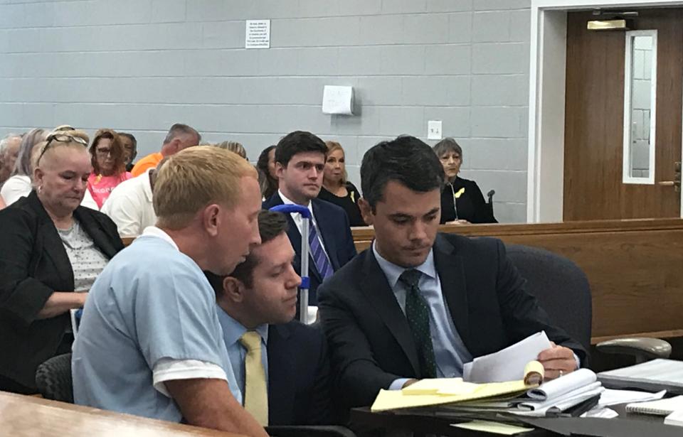 Adam Braseel, left, talks with his attorneys, Alex Little and Zach Lawson, during a hearing in Grundy County Circuit Court on Wednesday, June 29, 2019.
