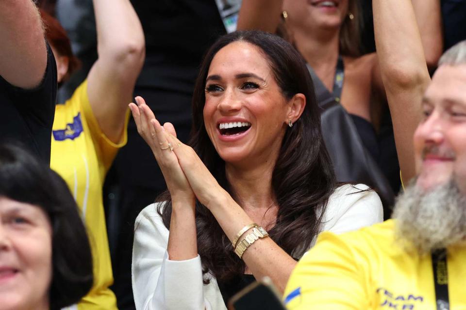 <p>Chris Jackson/Getty</p> Meghan Markle cheers during a wheelchair basketball match during the Invictus Games in Dusseldorf, Germany on Sept. 13.