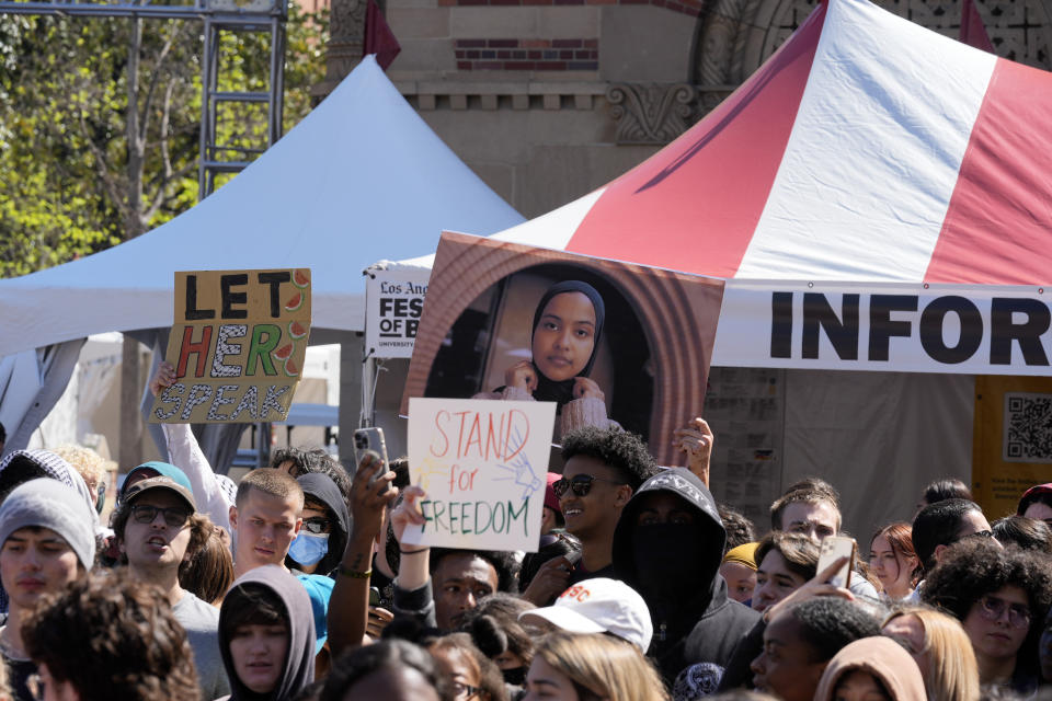 Students hold up a photo of USC 2024 valedictorian Asna Tabassum in protest to her canceled commencement speech on the campus of University of Southern California, Thursday, April 18, 2024. The University of Southern California canceled the commencement speech by its 2024 valedictorian who has publicly supported Palestinians, citing security concerns, a rare decision that was praised by several pro-Israel groups and lambasted by free speech advocates and the country's largest Muslim civil rights organization. (AP Photo/Damian Dovarganes)