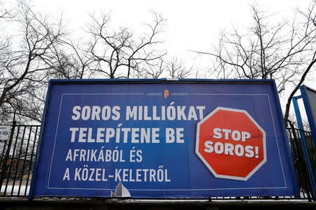 FILE PHOTO: A government billboard is seen in Budapest, Hungary, February 14, 2018. A billboard reads: 'Soros wants to transplant millions from Africa and the Middle East'. REUTERS/Bernadett Szabo/File Photo