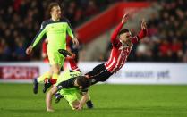 <p>Dusan Tadic goes to ground under James Milner’s tackle (Getty Images) </p>