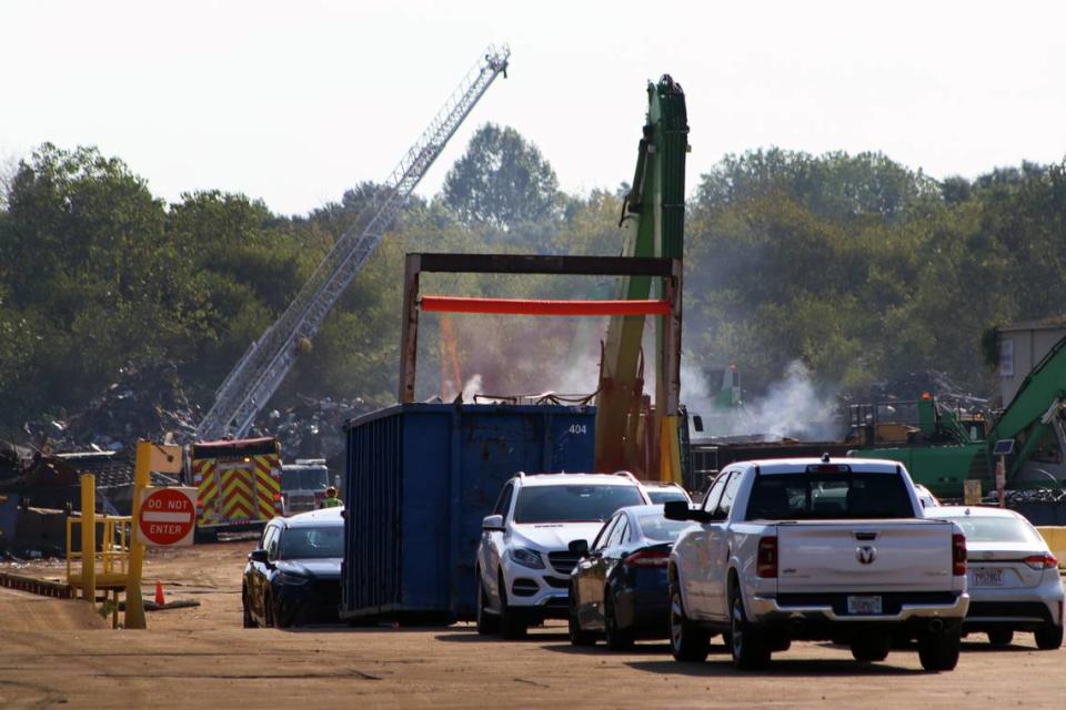 Light smoke continues burning, two days after the fire started at Radius Recycling. Fire crews were working to separate piles of burned debris.