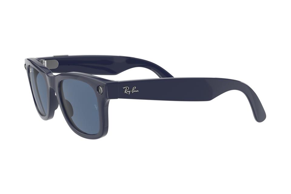 A pair of Ray-Ban Stories Wayfarer Shiny Blue Polarized Dark Blue Lenses