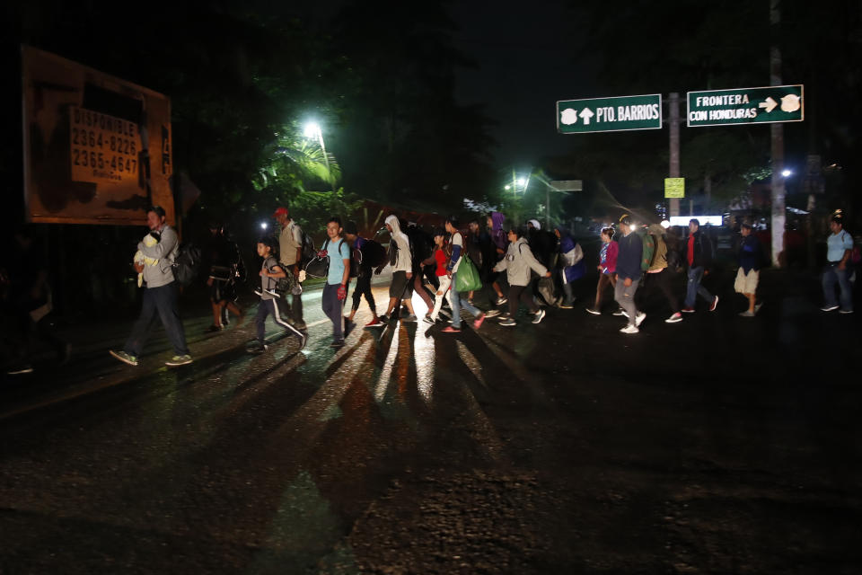 Migrants from Honduras begin their journey in the hopes of reaching the distant United States, in Entre Rios, Guatemala, Thursday, Jan. 16, 2020. Hundreds of migrants arrived at the Guatemala border after walking and hitching rides from San Pedro Sula, Honduras in a bid to form the kind of migrant caravan that reached the U.S. border in 2018. (AP Photo/Moises Castillo)