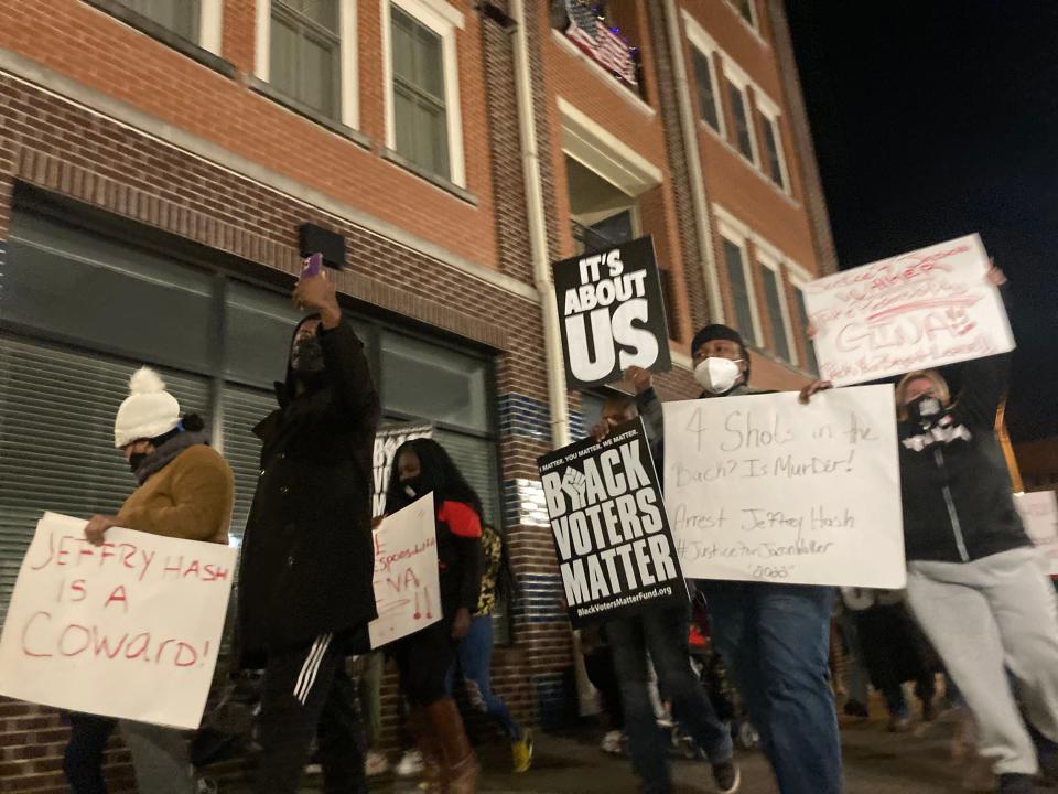 Protesters march Tuesday, Jan. 11, 2022, along Hay Street in downtown Fayetteville on the third night of protests on behalf of Jason Walker, an unarmed Black man shot by an off-duty deputy.
