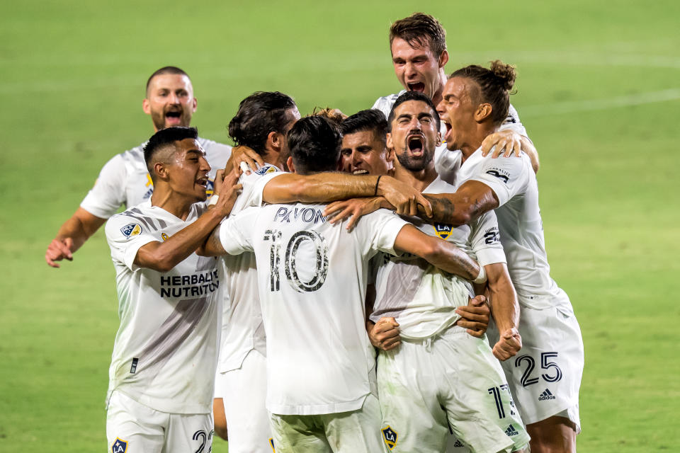 The Los Angeles Galaxy celebrate Sebastian Lletget's first goal on Sunday in a 3-0 win over LAFC. (Photo by Shaun Clark/Getty Images)