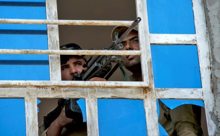 Iraqi forces guard a position in the northwestern al-Haramat neighbourhood of Mosul on May 9, 2017