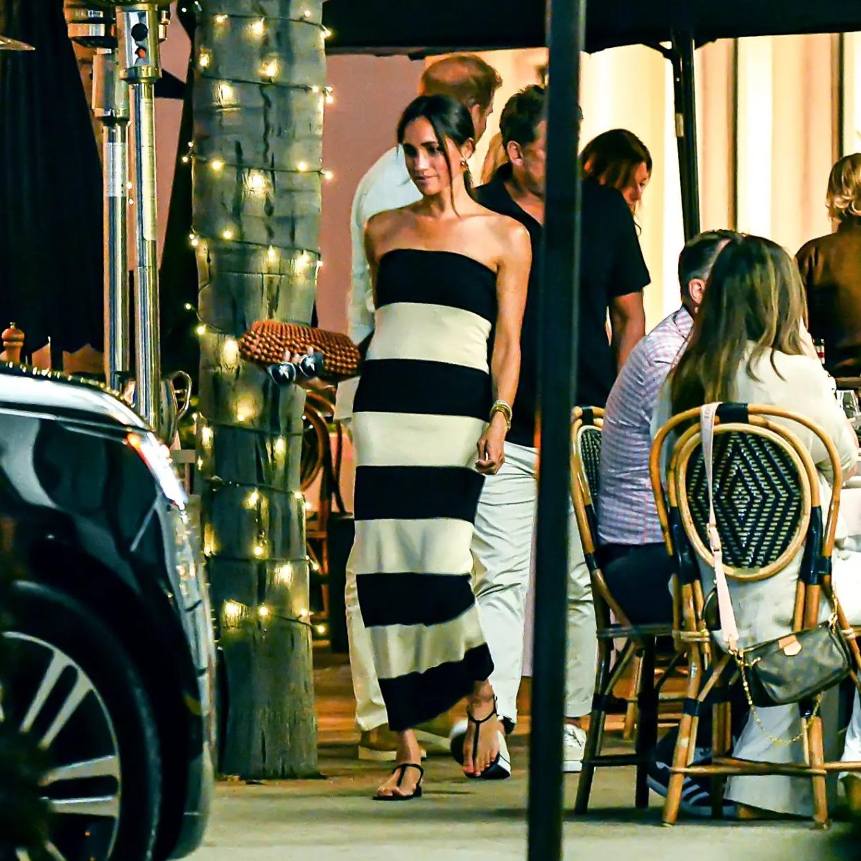  Meghan Markle in a black and white striped tube dress 