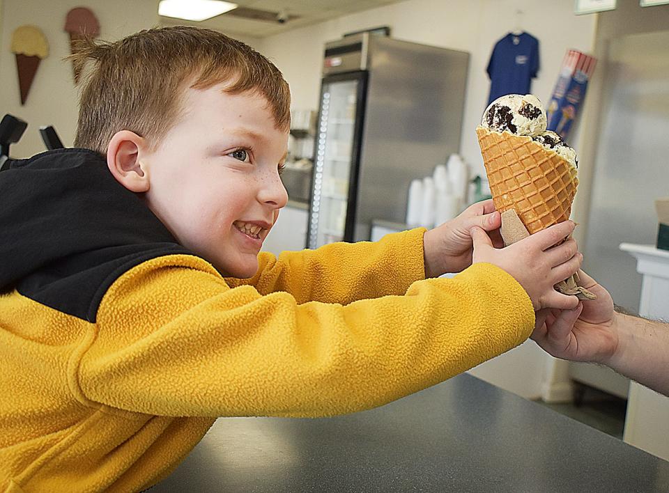 Connor Cabral of Fall River with an Oreo waffle cone at Somerset Creamery in 2023.