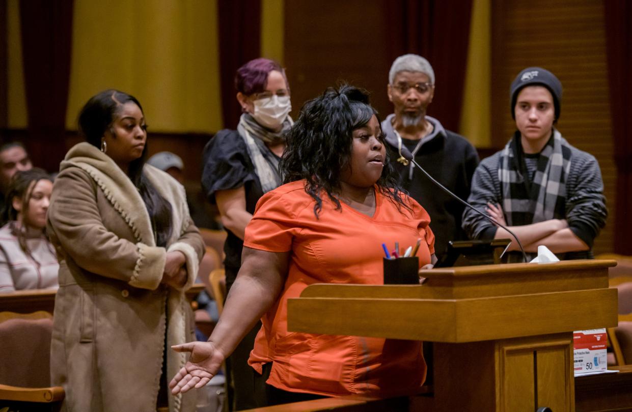 Raychell Washington joins a small group of East Bluff residents to ask for help from the Peoria City Council during a council meeting Tuesday, Dec. 13, 2022, at Peoria City Hall. Dozens of residents in East Bluff rentals are being forced out by the end of the year by new owners Darwin Homes.