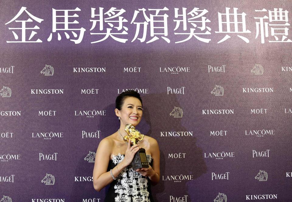 Chinese actress Zhang Ziyi celebrates winning the Best Leading Actress for "The Grandmaster" at the 50th Golden Horse Film Awards in Taipei