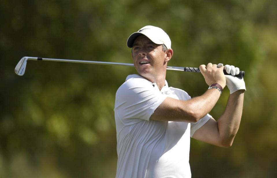 Rory McIlroy of Northern Ireland tees off at the fourth hole during DP World Tour Championship in Dubai, United Arab Emirates, Sunday, Nov. 20, 2022. (AP Photo/Martin Dokoupil)