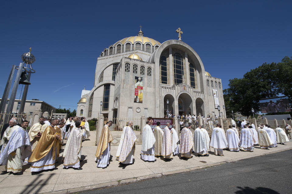 Priests and other religious leaders enter the Ukrainian Catholic Cathedral of the Immaculate Conception during the enthronement of Borys Gudziak as head of the Catholic Archeparchy of Philadelphia in Philadelphia, Tuesday, June 4, 2019. (Jose Moreno/The Philadelphia Inquirer via AP)