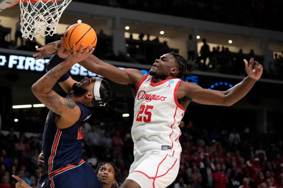 Auburn forward Johni Broome has a layup blocked by Houston forward Jarace Walker in the second half of a second-round game in the NCAA tournament in Birmingham, Ala., Saturday, March 18, 2023.