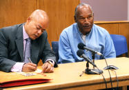 <p>O.J. Simpson (R) reacts at his parole hearing with attorney Malcolm LaVergne at Lovelock Correctional Centre in Lovelock, Nevada, U.S. July 20, 2017. (Jason Bean/Pool/Reuters) </p>