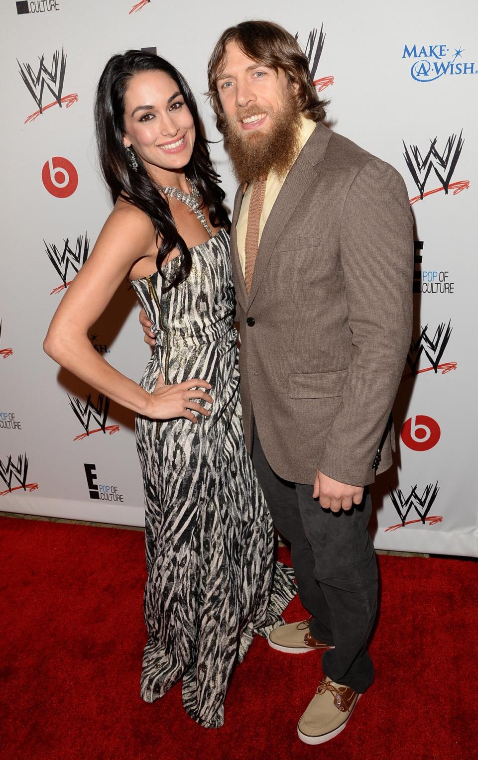 Brie Bella (L) and wrestler Daniel Bryan attend WWE & E! Entertainment's "SuperStars For Hope" at the Beverly Hills Hotel on August 15, 2013 in Beverly Hills, California