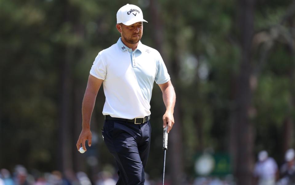 Xander Schauffele walking on the first green