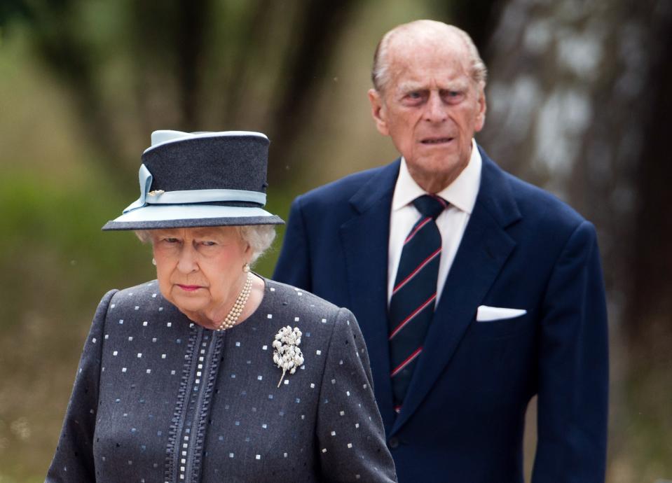 Britain's Queen Elizabeth II and The Duke of Edinburg, Prince Philip (L) visit the memorial site of former Nazi concentration camp Bergen-Belsen on June 26, 2015.  AFP PHOTO / POOL / JULIAN STRATENSCHULTE        (Photo credit should read JULIAN STRATENSCHULTE/AFP via Getty Images)