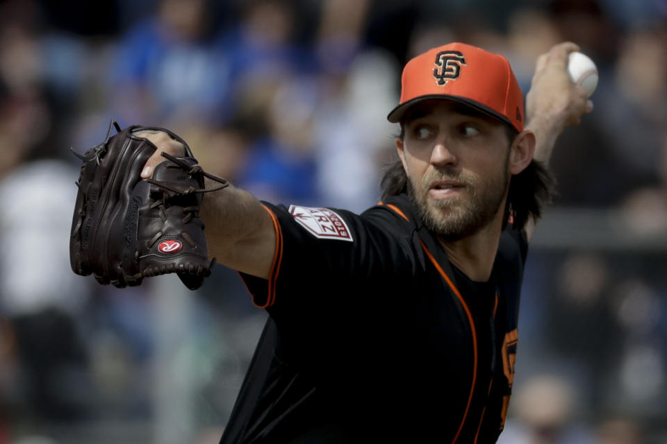 San Francisco Giants starting pitcher Madison Bumgarner throws against the Chicago Cubs during the first inning of a spring baseball game in Scottsdale, Ariz., Sunday, Feb. 24, 2019. (AP Photo/Chris Carlson)