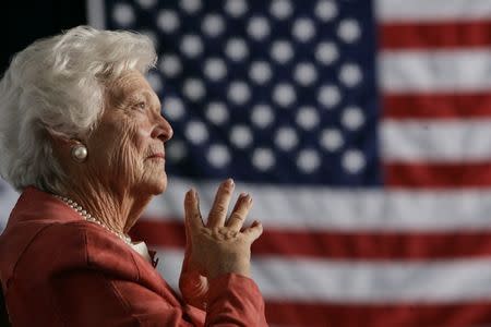FILE PHOTO: Former U.S. first lady Barbara Bush listens to her son, President George W. Bush, as he speaks at an event on social security reform in Orlando, Florida, March 18, 2005. REUTERS/Jason Reed JIR/HB
