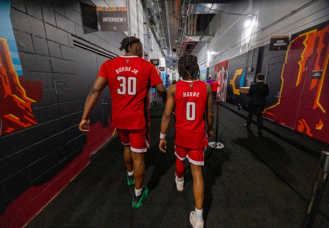 N.C. State’s D.J. Burns Jr. (30) and D.J. Horne (0) walk back to their locker room following their loss to Purdue in the NCAA Final Four National Semifinal game against Purdue on Saturday, April 6, 2024 at State Farm Stadium in Glendale, AZ.