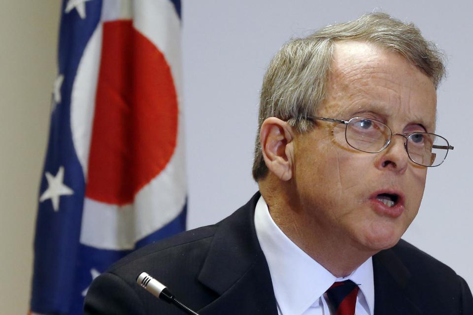 FILE - This Nov. 25, 2013 file photo shows Ohio Attorney General Mike DeWine speaking in Steubenville, Ohio. Negative campaigning and mudslinging may be a fact of life in American politics, but can false accusations made in the heat of an election be punished as a crime? That debate makes its way to the Supreme Court next week as the justices consider a challenge to a controversial Ohio law that bars false statements about political candidates during a campaign. DeWine, says he has serious concerns about the law. His office filed two briefs in the case, one from staff lawyers obligated to defend the state and another expressing DeWine's personal view that the law "may chill constitutionally protected political speech." (AP Photo/Keith Srakocic, File)