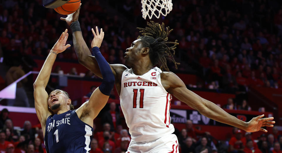 Rutgers center Clifford Omoruyi (11) blocks the shot of Penn State guard Seth Lundy (1) during the first half of an NCAA college basketball game in Piscataway, N.J. Tuesday, Jan. 24, 2023. (AP Photo/Noah K. Murray)