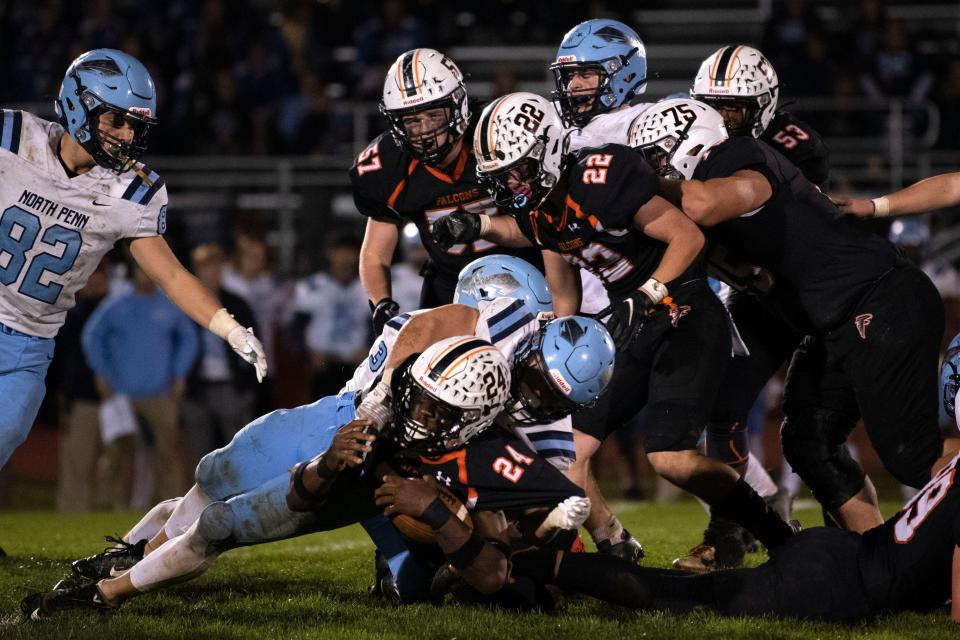 North Penn senior Bobby Hill takes down Pennsbury senior Galamama Mulbah during the Knights' 22-21 win in the first round of PIAA District One Class 6A playoffs.