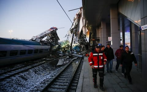  Rescue workers evacuate injured passengers after high-speed train crashed in Turkish capital Ankara  - Credit: Getty