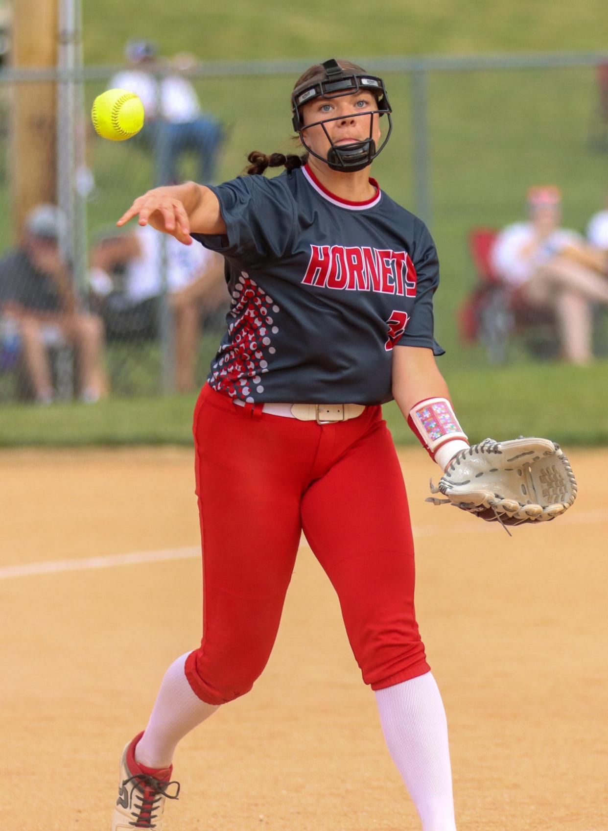 Avery Layton turns to make the defensive play toward first base.