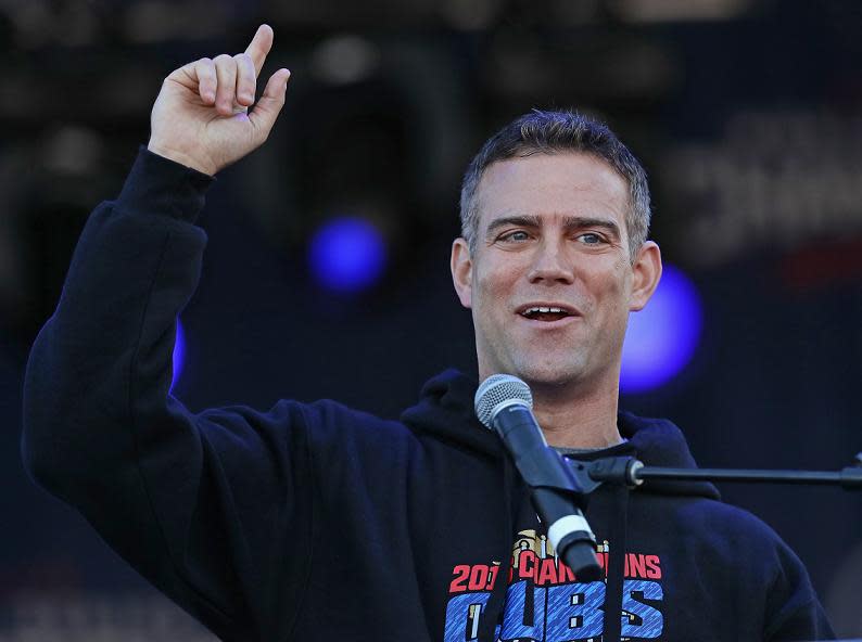 Hours before singing, Cubs president Theo Epstein addresses the crowd at the team's championship rally in Grant Park. (Getty Images)