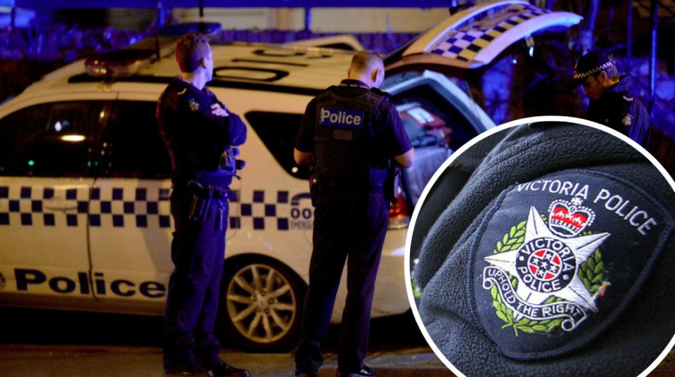 Victoria policemen with police car and police badge