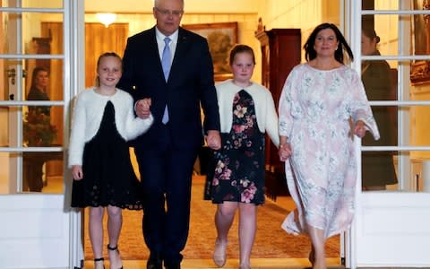 Australian Prime Minister Scott Morrison walks with his wife Jenny and his daughters after the swearing-in ceremony in Canberra, Australia August 24 - Credit: DAVID GRAY/Reuters 