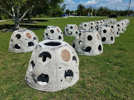 Some of the 66 Eternal Reef balls with plaques representing each of the submarines and crewmembers lost at sea since 1900, which will be deployed to the ocean floor for the undersea memorial during a ceremony this Memorial Day weekend, off the coast of Sarasota, Florida U.S., May 23, 2018. Brian Dombrowski/EternalReefs.com/Handout via REUTERS/Files