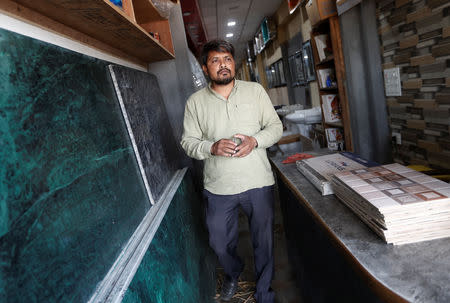 FILE PHOTO: Aas Mohammed walks out from his shop in Siyana town in the northern state of Uttar Pradesh, India May 15, 2019. REUTERS/Adnan Abidi