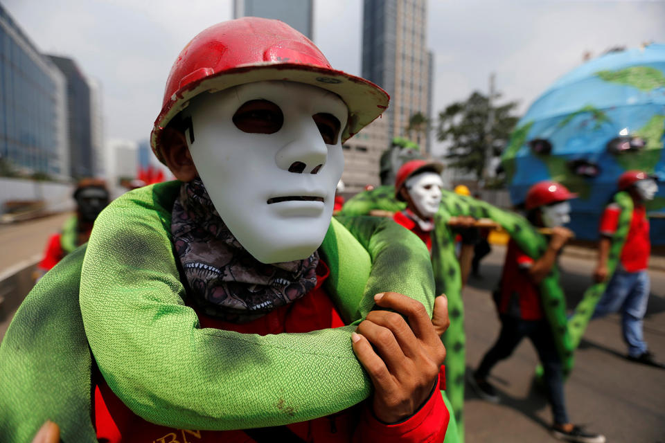 Workers wear masks during march