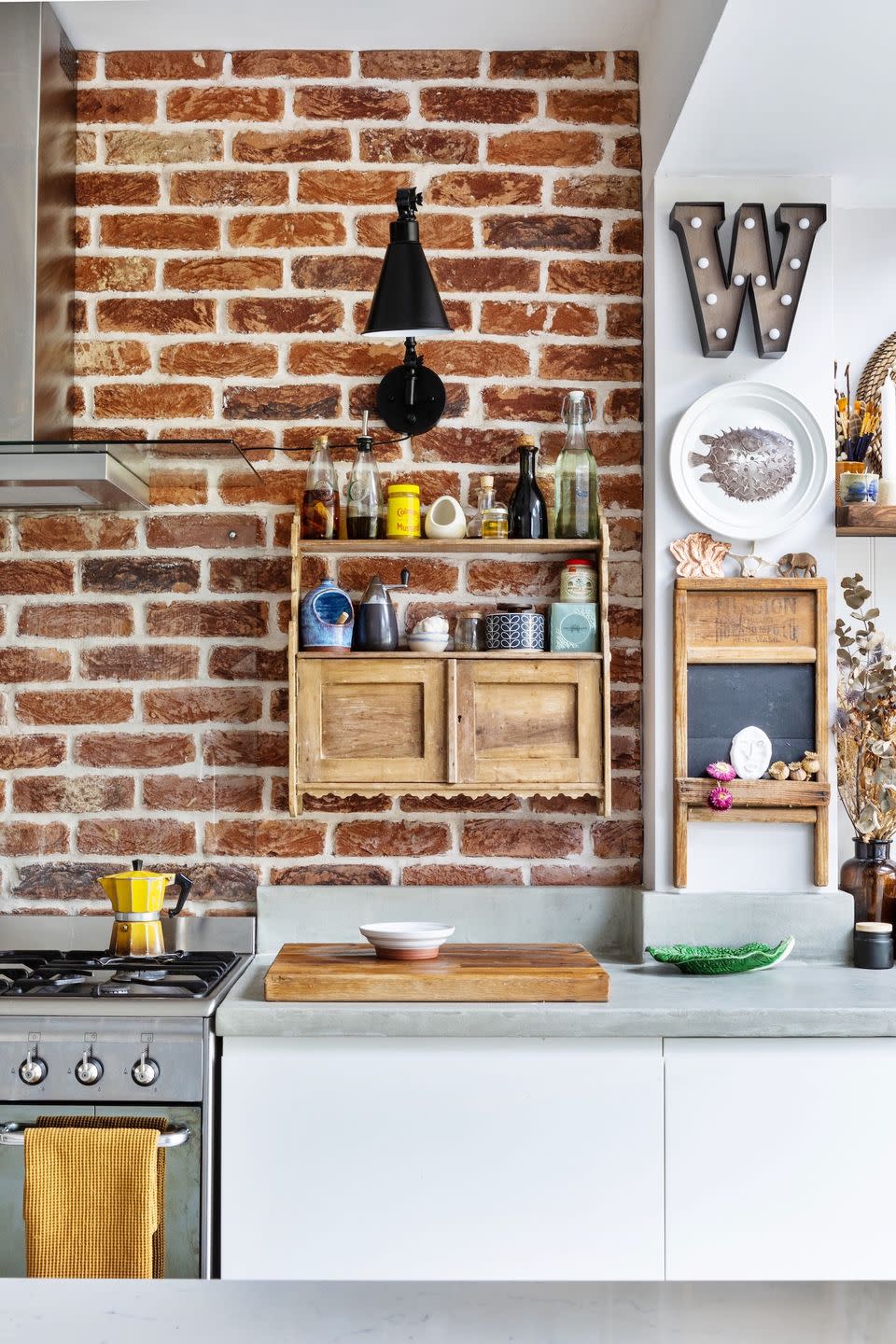 exposed brick wall and washboard in kitchen
