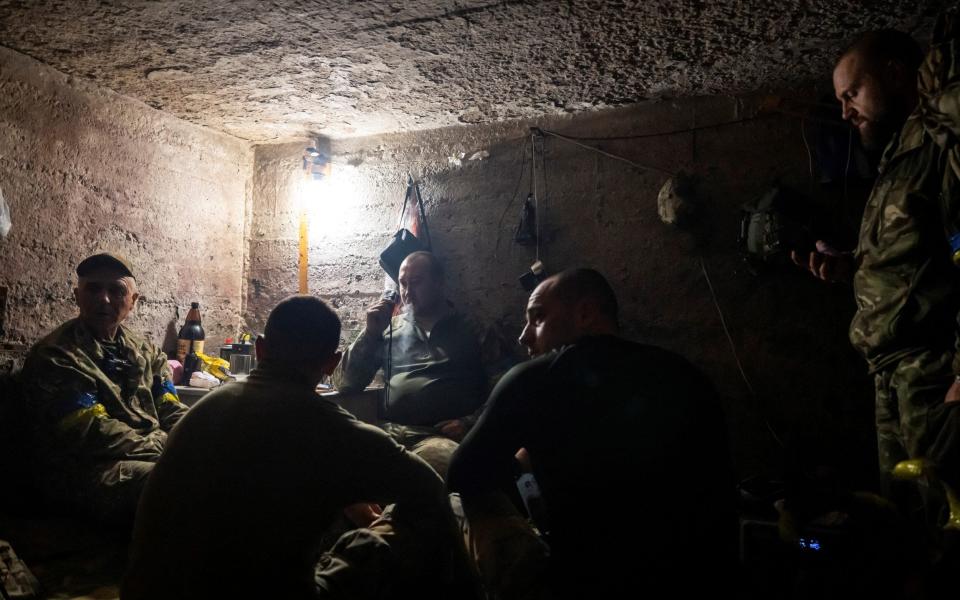 Artillerymen rest in a dugout near the village of Lyptsi in the Kharkiv region, June 18